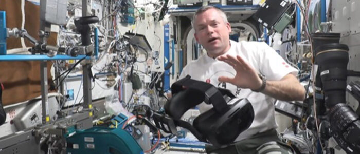 Andreas Mogensen with the Virtual Reality headset used to provide Syncsenses' nature experiences during execersise on the International Space Station. Photo: ESA / NASA ISS-Video