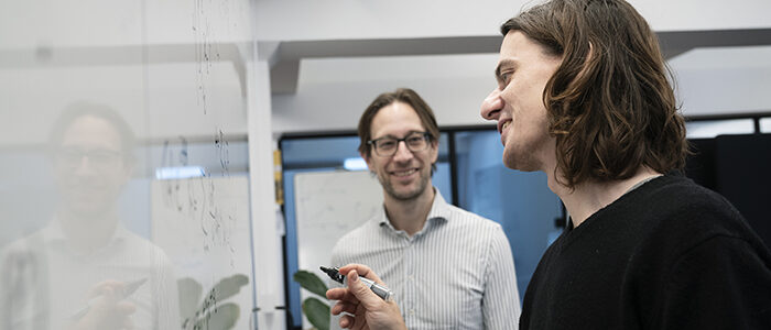 Marek Miller & Mathias Christiandl working out quantum simulations in Innovation District Copenhagen